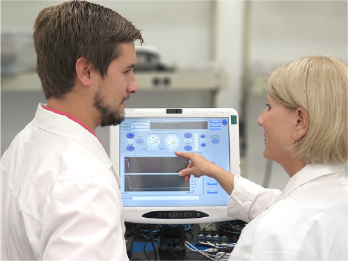 minnetronix engineers view medical device software on computer